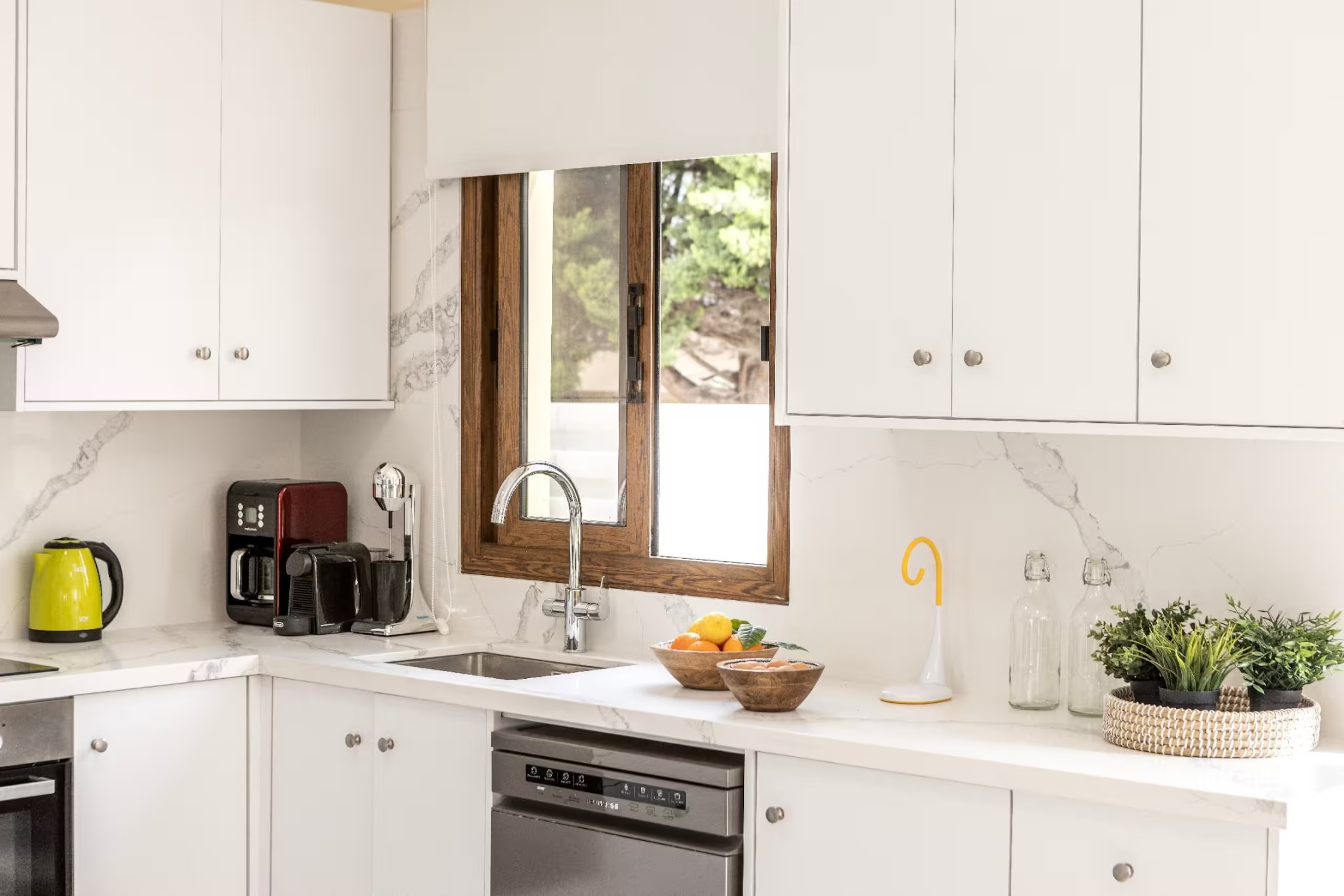 Villa Poseidon kitchen sink and dishwasher with coffee facilities on the counter
